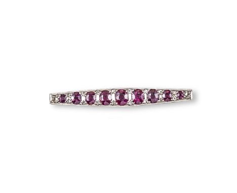 A ruby and diamond bar brooch, the graduated oval shaped rubies millegrain set with old cut diamonds in platinum and yellow g