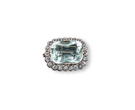 An aquamarine and white stone cluster brooch, the cushion shaped aquamarine is set within a surround of old cut white stones 