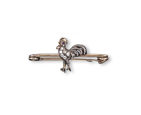 A Victorian diamond set cockerel brooch, set with old cut diamonds and a ruby eye in silver and gold on a yellow gold safety 