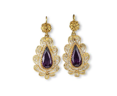 A pair of 19th century gold filigree and amethyst earrings, the pear shaped amethysts within scrolling filligree surround. 5.