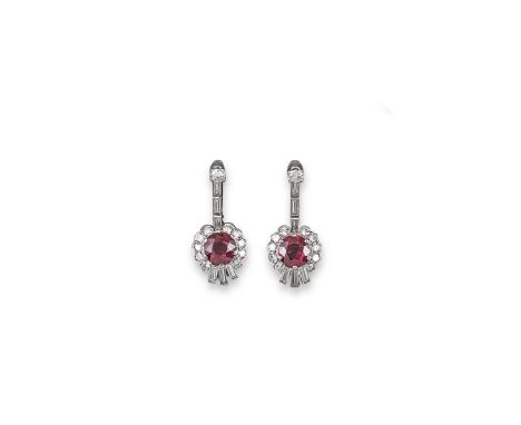 A pair of Burmese ruby and diamond drop earrings, the circular cut rubies weigh approximately 1.30 and 1.50ct and are set wit