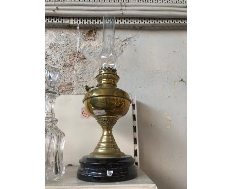 A brass oil lamp. 