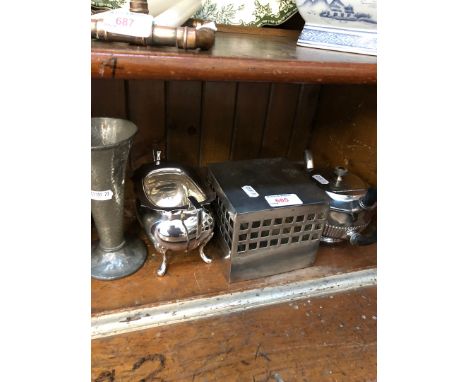 A silver plate teapot and sugar bowl and two other metal items 