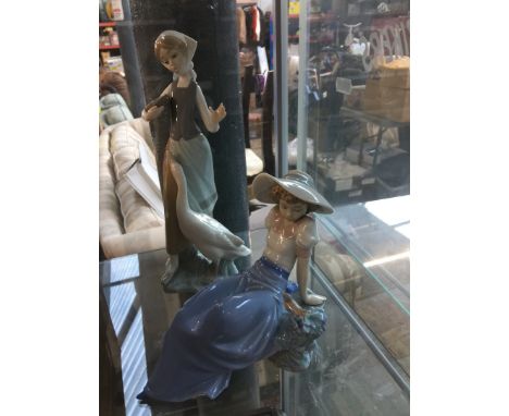 Lladro figure of a girl with goose and a Nao figure of a girl with bird 