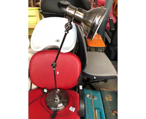 A metal desk lamp 