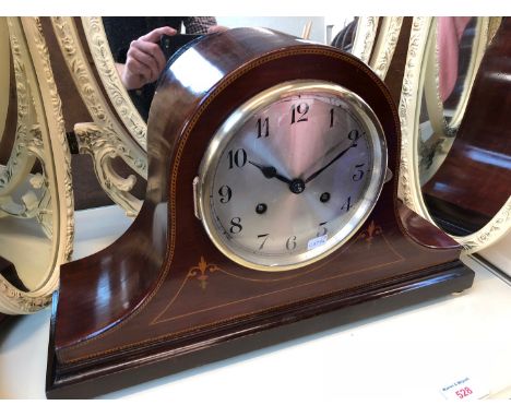 An inlaid mahogany mantle clock. 