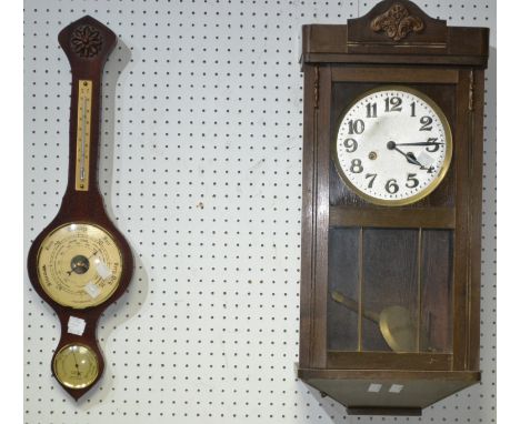 A 1940's wall clock; a reproduction wall barometer