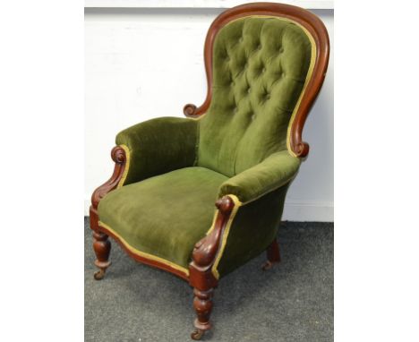 A Victorian mahogany spoonback chair, button upholstered back, scrolling arms, serpentine stuffed overseat, turned forelegs, 