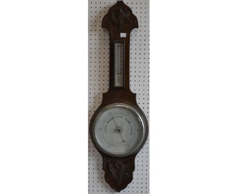 An early 20th century oak aneroid barometer