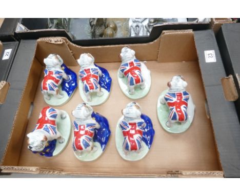 Unbranded ceramic figures of Bulldogs carrying EU flags with Brexit themes (7).