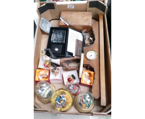A mixed collection of ceramic and resin items including novelty boxed jewelled crowns, Britannia themed glass snowglobes, roy