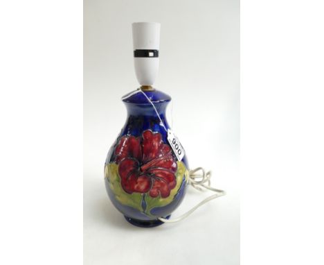 A Moorcroft Hibicus on blue ground small lamp base. Height 28cm