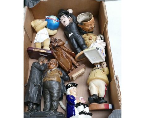 A mixed collection of novelty ceramic items including unmarked Kevin Francis Clarice Cliff figure, Toby jugs, and a selection