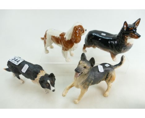 Royal Doulton figure of a Border Collie DA143, Alsation DA103 and Beswick Corgi Black Prince 1299A and a King Charles Spaniel