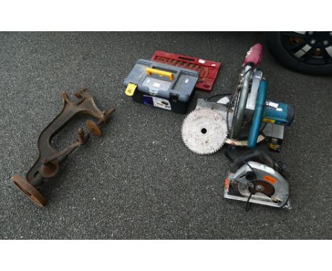 Collection of tools to include Makita power saw and other Challenge branded saw, vintage manual drill press, tool box with sp