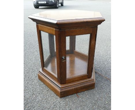 20th Century oak hexagon shaped display cabinet, with interior lighting, 6 glazed panels and a single door 