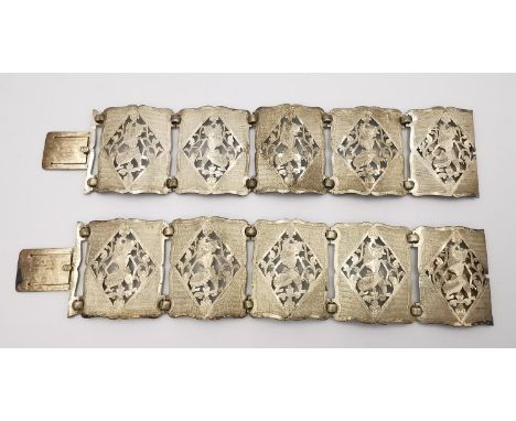 Two Chinese 800 silver articulated panel bracelets with pierced Indonesian shadow puppet figure design. Fastens with a hidden