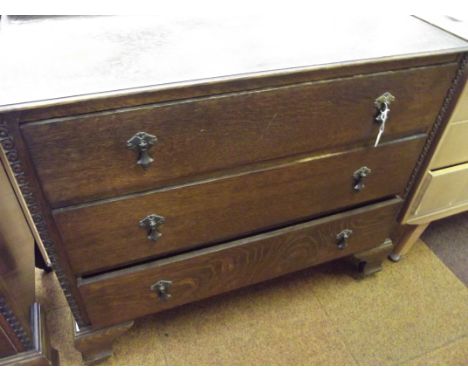 Oak chest of three drawers on bracket feet