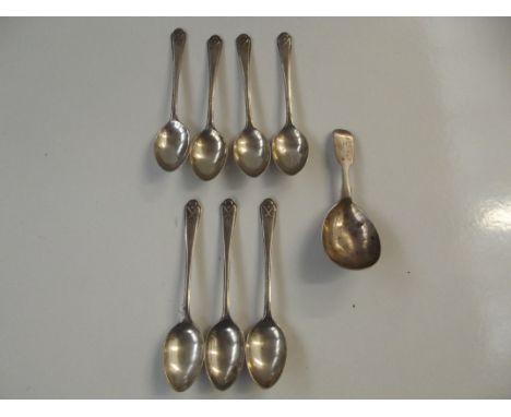 Seven silver teaspoons with crossed golf clubs and ball terminals by Walker and Hall, together with a Victorian silver caddy 