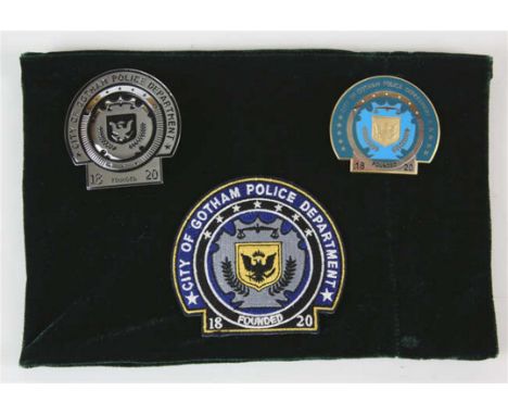 The Dark Knight Rises (2012)  a group of three Gotham Police Department badges, two being metal and one being an embroidered 
