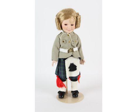 Shirley Temple china doll made by Danbury Mint. Doll show Temple in costume from the film 'Wee Willie Winky'. Approx 36cm hig