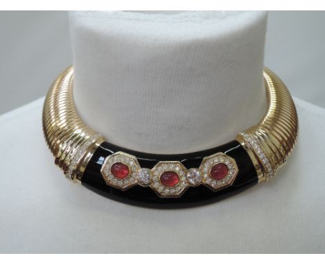 A 1980's snake link collarette necklace by Christian Dior having a central black enamel panel with red paste and diamante dec