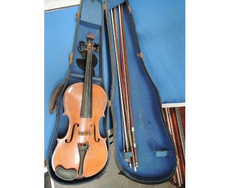 A 19th century violin, bearing label, Antonius Stradivarius, having two piece back, with case and bows