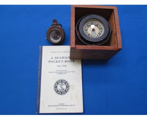 A First World War British military compass, a Second World War Seaman's pocket book, dated June 1943, and an American Star, B