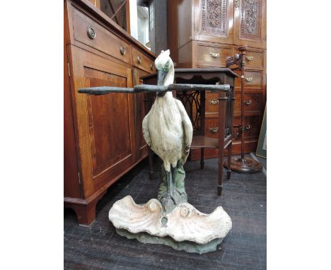 A 19th century cast iron stick stand in the Coalbrockdale  style having registration lozenge modelled as Heron with rattlesna