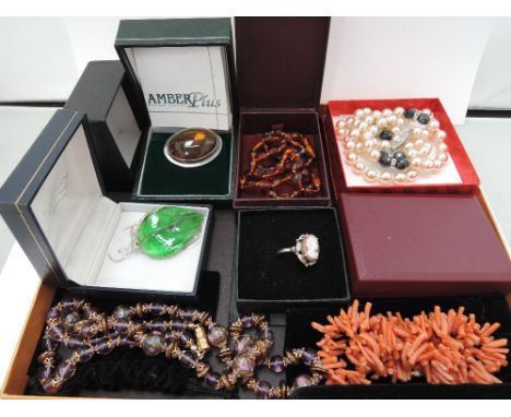 A small selection of costume jewellery including coral, Venetian glass, Cameo ring and brooch stamped silver, Amber style bea