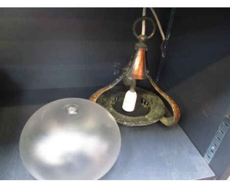 A copper ceiling light of Art Nouveau design having bulbous, frosted glass shade