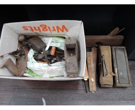 A selection of vintage tools including block planes, rules etc