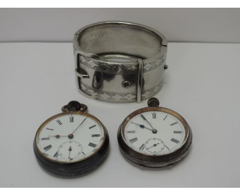 Two base metal top wound pocket watches having Roman numeral dials with subsidiary seconds, and a hinged bangle modelled as a