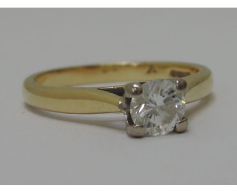 A ladies diamond solitaire ring approx .45ct in a raised open mount on an 18ct gold loop