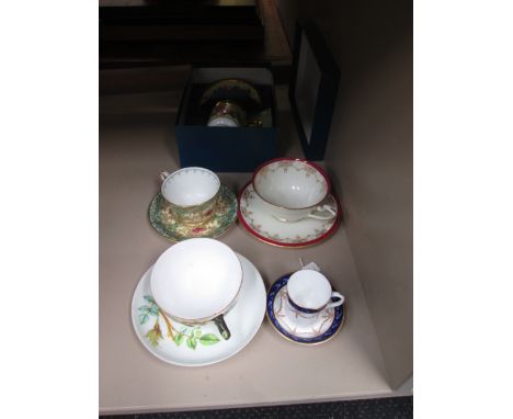 A set of cabinet cups and saucers including Royal Worcester Connoisseur English Flowers