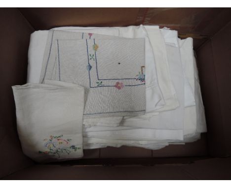 A large box of vintage bed linen including sheets, pillow cases, guest towels etc