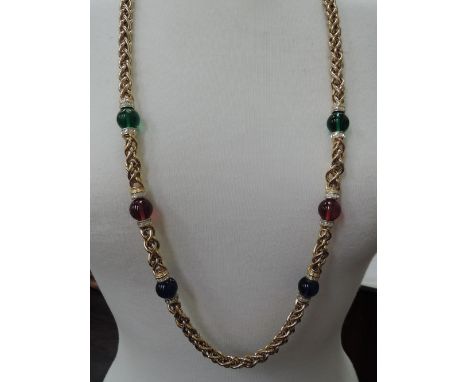 A 1980's long fancy link necklace by Christian Dior having red, green, blue and diamante bead insert decoration 