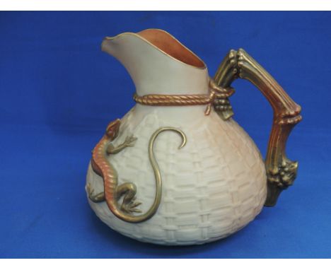 A Royal Worcester lizard jug having gilt heightened decoration on blush ivory ground, number 1714