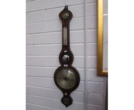 An early 19th century mahogany wheel barometer having humidity and thermometer scale