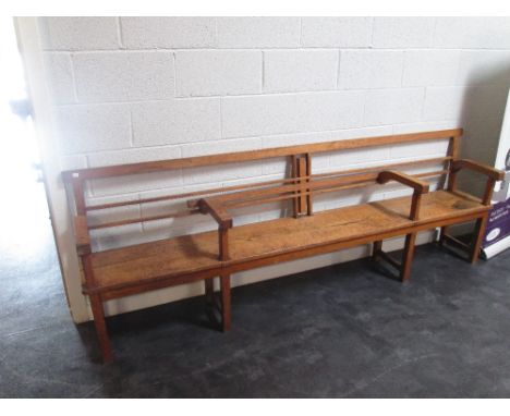 An early 20th century golden oak Arts & Crafts bench in the Webb Davies style