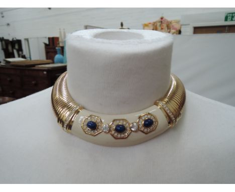 Two 1980's snake link collarette necklaces by Christian Dior having  central cream enamel panels with blue paste and diamante