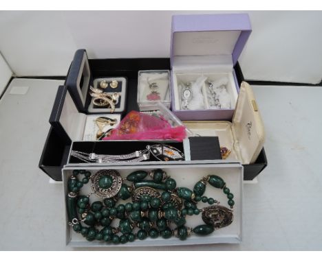 A small selection of costume jewellery including a pair of clip earrings by Christian Dior, earrings and brooch set by Ciro, 