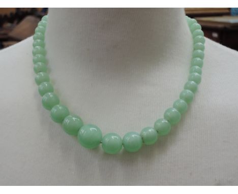 A string of graduated jade beads