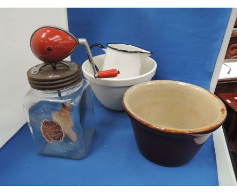 A vintage Blow butter churn, two pudding basins and an enamel jug