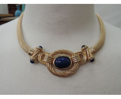 A 1980's necklace by Christian Dior having a woven style chain with central Lapis Lazuli style stone within a heavy mount and