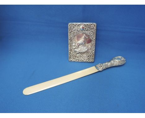 A silver desk blotter depicting a Shepherds dog 'On Guard' within extensive repousse decorated border, Chester,1904  E J Trev