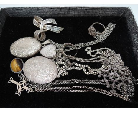A small selection of HM silver and white metal including pendants, lockets, brooches and filligree ring
