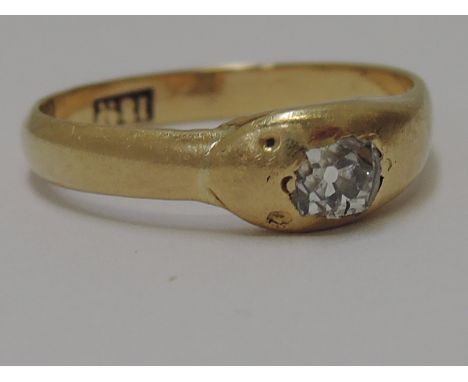 A ladies 18ct gold serpent ring having an inset diamond to head .25ct