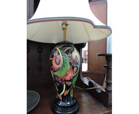 A modern Moorcroft table lamp, in bulbous shape 46/12, in the Queen's Choice pattern, and a Roscha ceramic plaque having hero