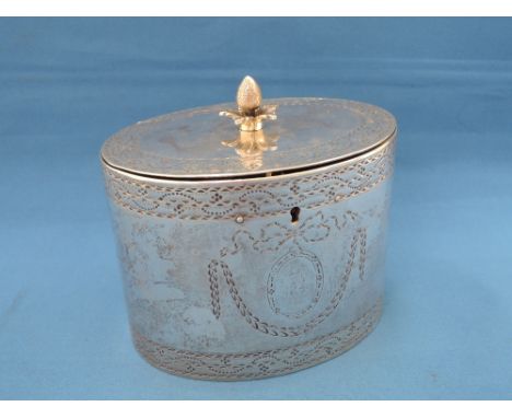 A Georgian silver tea caddy having lockable hinged lid with pineapple finial and bright cut engraved decoration,  London 1779